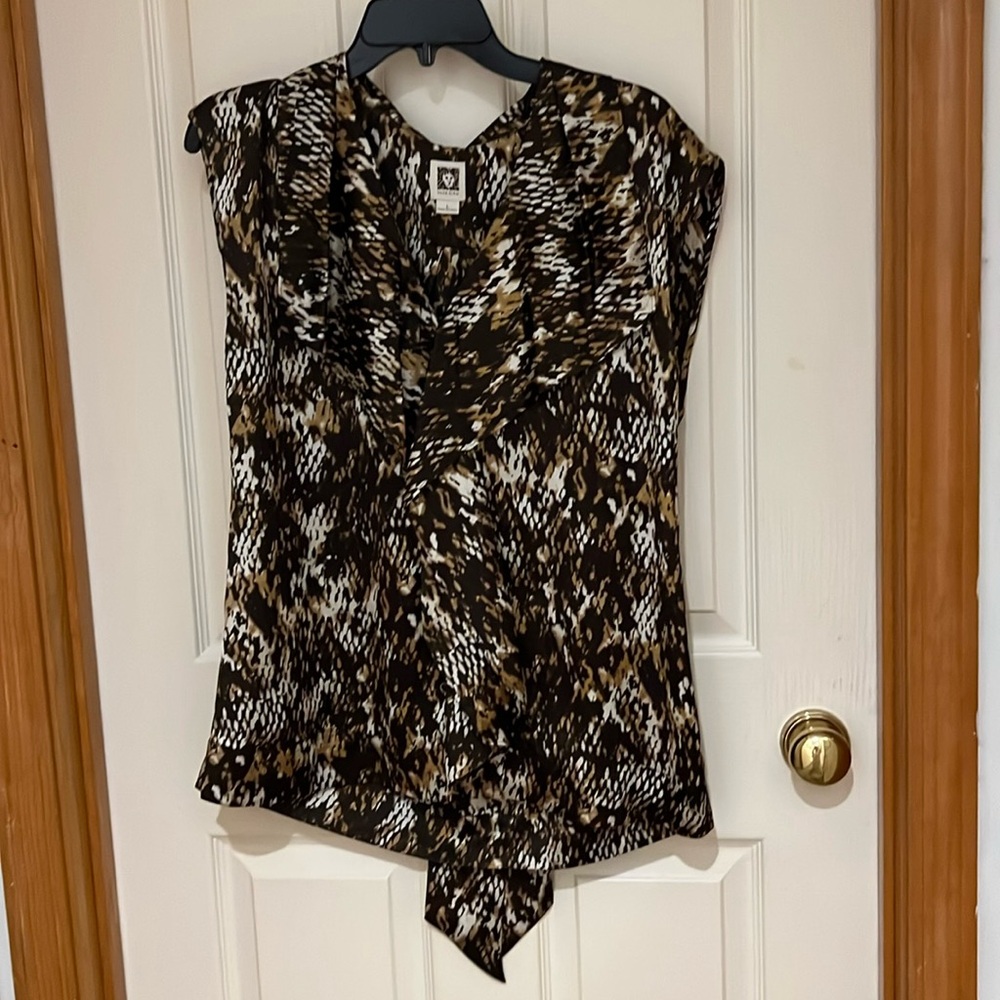 Almost new dressy blouse. Animal print. Looks nice with suit coat